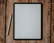 white and black board on brown wooden surface