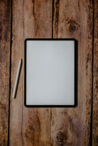 white and black board on brown wooden surface